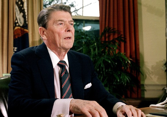 FILE - This Jan. 28, 1986, file photo shows President Ronald Reagan in the Oval Office of the White House after a televised address to the nation about the space shuttle Challenger explosion. In momen ...