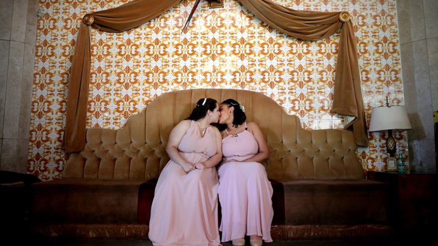 epa07248876 YEARENDER DECEMBER 2018

A lesbian couple kiss as they participate in a mass wedding in Sao Paulo, Brazil, 15 December 2018. Some 38 gay couples took part in the wedding ceremony as same ...