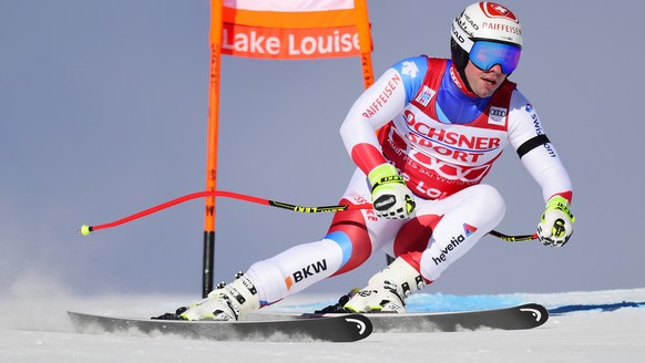Beat Feuz, of Switzerland, skis down the course during the men&#039;s World Cup downhill ski race in Lake Louise, Alberta, Saturday, Nov. 24, 2018. (Crank Gunn/The Canadian Press via AP)
