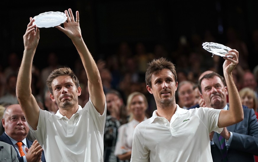 epa07715181 Nicolas Mahut (L) of France and Edouard Roger-Vasselin of France pose with the runner-up trophy after losing against Juan Sebastian Cabal of Colombia and Robert Farah of Colombia during th ...