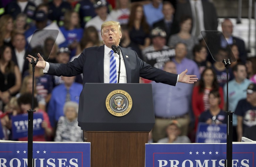 epa06963358 United States President Donald J. Trump speaks to supporters during a rally at the Charleston Civic Center in Charleston, West Virginia, USA, 21 August 2018. Trump is slated to appear at u ...