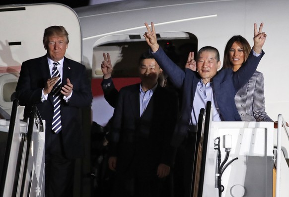 President Donald Trump and first lady Melania Trump greet former North Korean detainees Kim Dong Chul, second right, Tony Kim, center, and Kim Hak Song, behind Tony Kim, upon their arrival, Thursday,  ...