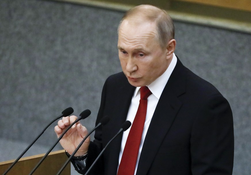 Russian President Vladimir Putin gestures while speaking during a session prior to voting for constitutional amendments at the State Duma, the Lower House of the Russian Parliament in Moscow, Russia,  ...