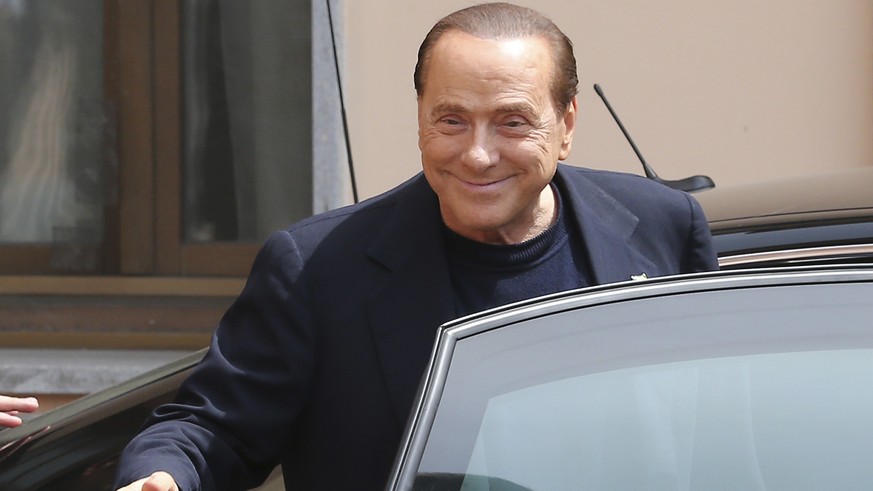 Former Italian Premier Silvio Berlusconi smiles as he leaves the &quot;Sacra Famiglia&quot; foundation in Cesano Boscone, near Milan, Italy, Friday, May 9, 2014. Berlusconi, 77, was ordered to perform ...