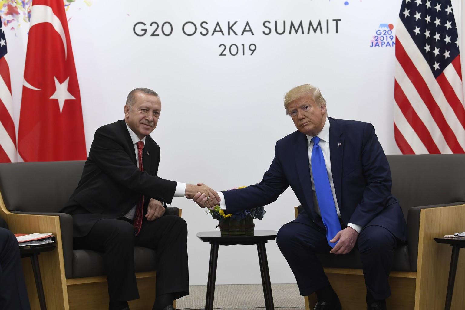 President Donald Trump, right, shakes hands with Turkish President Recep Tayyip Erdogan, left, during a meeting on the sidelines of the G-20 summit in Osaka, Japan, Saturday, June 29, 2019. (AP Photo/ ...
