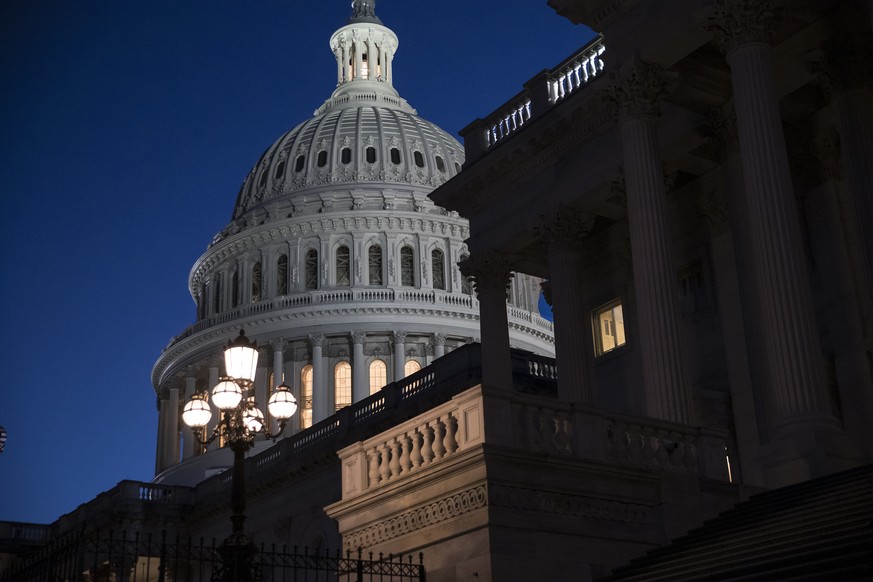 The Capitol is seen at day&#039;s end as the Senate works on a House-passed bill that would pay for President Donald Trump&#039;s border wall and avert a partial government shutdown, at the Capitol in ...