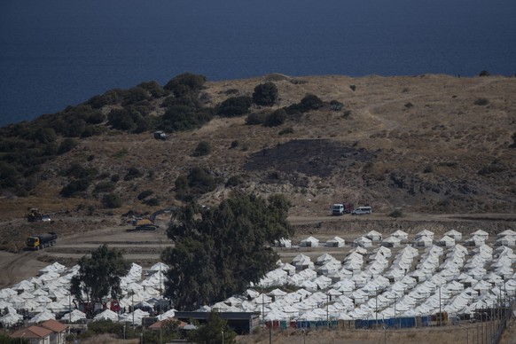 A general view of the temporary camp for refugees and migrants near Mytilene town, on the northeastern island of Lesbos, Greece, Sunday Sept. 13, 2020. Greek authorities have been scrambling to find a ...