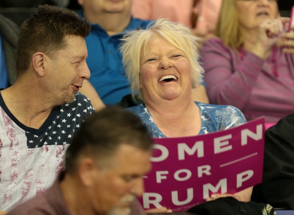 epa05860779 Supporters pass the time wiating for the beginning of a rally for US President Donald J. Trump at the Kentucky Exposition Center in Louisville, Kentucky, USA, 20 March 2017. Trump is appea ...