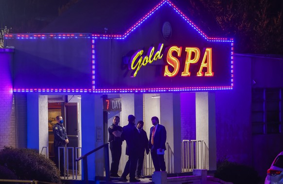 epaselect epa09078994 Atlanta Police Department officers investigate the scene of a shooting outside a spa on Piedmont Road in Atlanta, Georgia, USA, 16 March 2021. At least eight people were reported ...