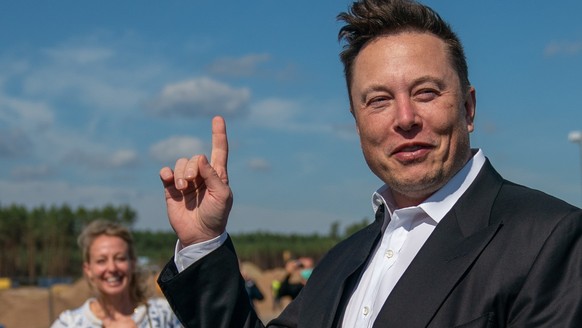 epa08925442 (FILE) - Tesla and SpaceX CEO Elon Musk (R) gives a statement at the construction site of the Tesla Giga Factory in Gruenheide near Berlin, Germany, 03 September 2020 (Reissued 07 January  ...