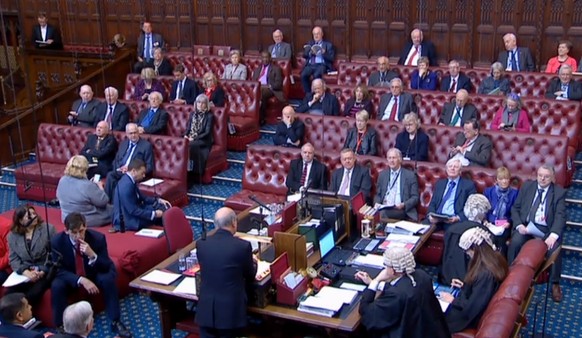 epa07484414 A grab from a handout video made available by the UK Parliamentary Recording Unit shows members of the British House of Lords debate a bill to force the prime minister to ask for an extens ...
