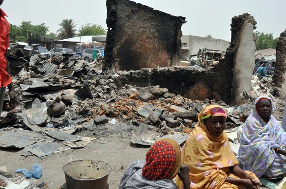 TOPSHOTS
Women sit at Gamboru central market on May 11, 2014 burnt by suspected Boko Haram insurgents during the May 5 attack at Ngala in Gamboru Ngala district, Borno State in northeastern Nigeria . ...