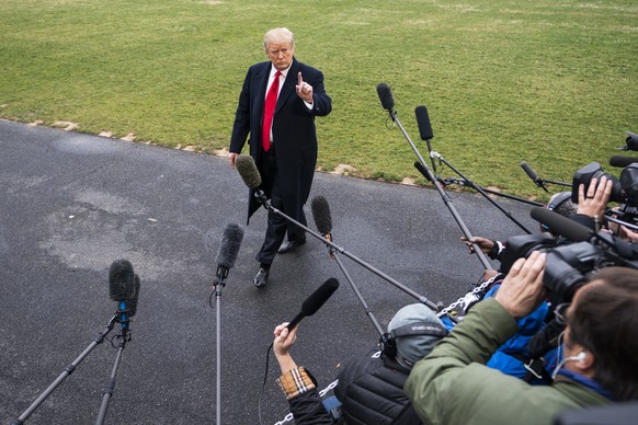 epa07455951 US President Donald J. Trump speaks to the media as he departs the White House for his Mar-a-Lago resort in Washington, DC, USA, 22 March 2019. The Trump administration, along with lawmake ...