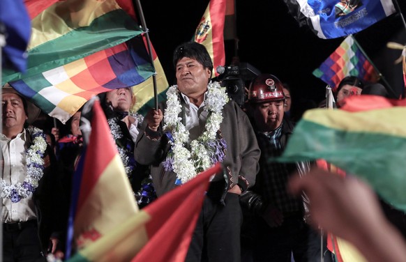 epa07957212 President of Bolivia Evo Morales (C) speaks to supporters during an event in El Alto, Bolivia, 28 October 2019. Morales called on supporters to defend the headquarters of the Bolivian Gove ...