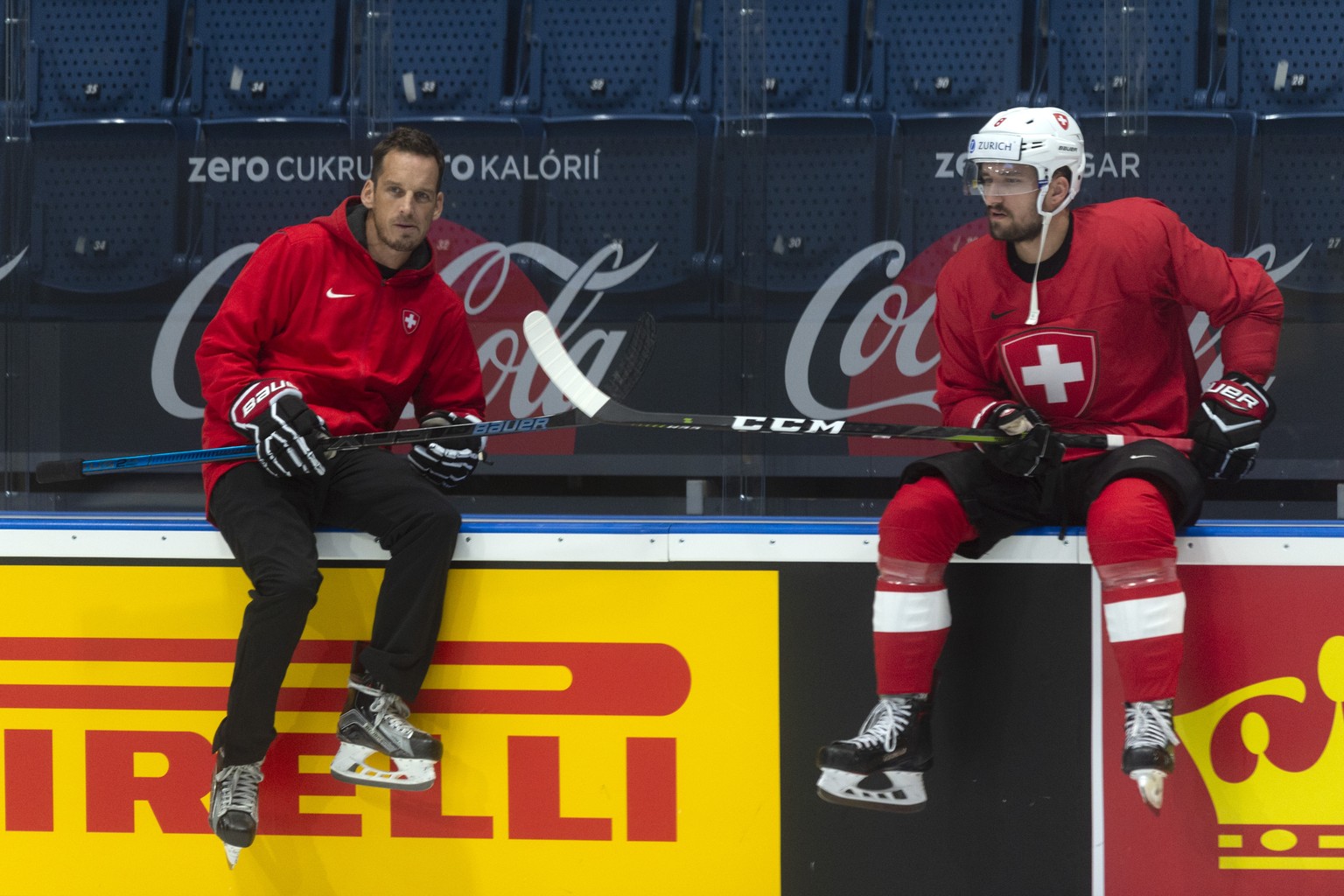 Switzerland&#039;s coach Patrick Fischer and Switzerland&#039;s Vincent Praplan during a training session of the Swiss team at the IIHF 2019 World Ice Hockey Championships, at the Ondrej Nepela Arena  ...