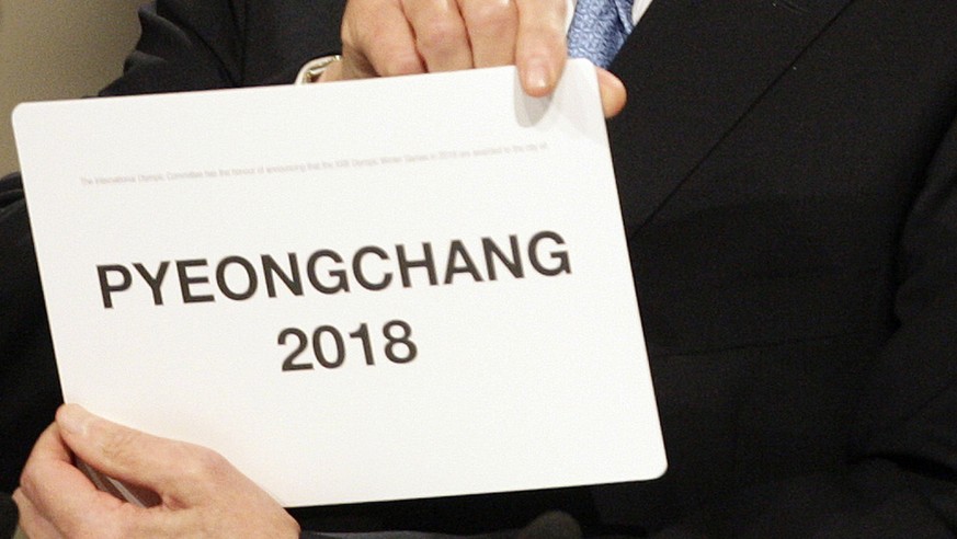 International Olympic Committee President Jacques Rogge opens the envelope announcing that Pyeongchang has won the bid to host the 2018 Olympic Winter Games in Durban, South Africa, Wednesday July 6,  ...