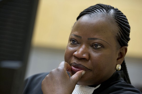 FILE - In this Nov. 27, 2013, file photo, prosecutor Fatou Bensouda waits for the start of the trial at the International Criminal Court (ICC) in The Hague, Netherlands. U.S. armed forces and the CIA  ...
