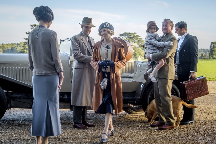 This image released by Focus features shows Elizabeth McGovern, from left, Harry Hadden-Paton, Laura Carmichael, Hugh Bonneville and Michael Fox, right, in a scene from &quot;Downton Abbey.&quot; The  ...