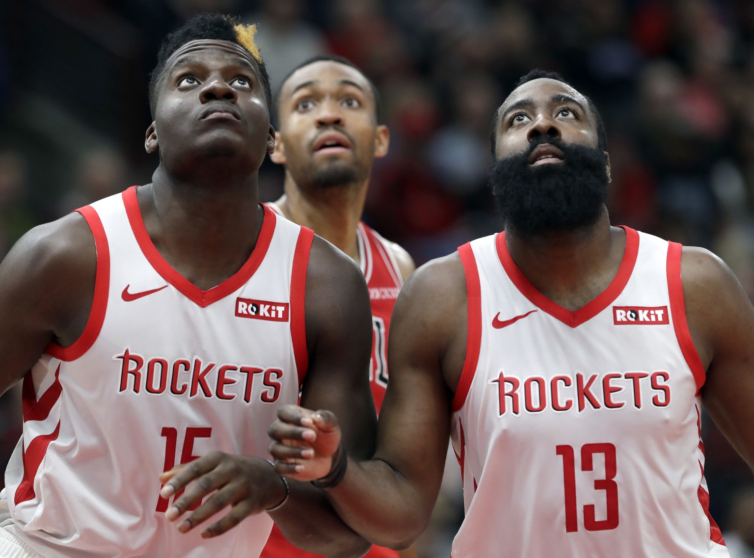 Houston Rockets center Clint Capela, left, and guard James Harden watch the ball during the second half of an NBA basketball game against the Chicago Bulls, Saturday, Nov. 3, 2018, in Chicago. (AP Pho ...
