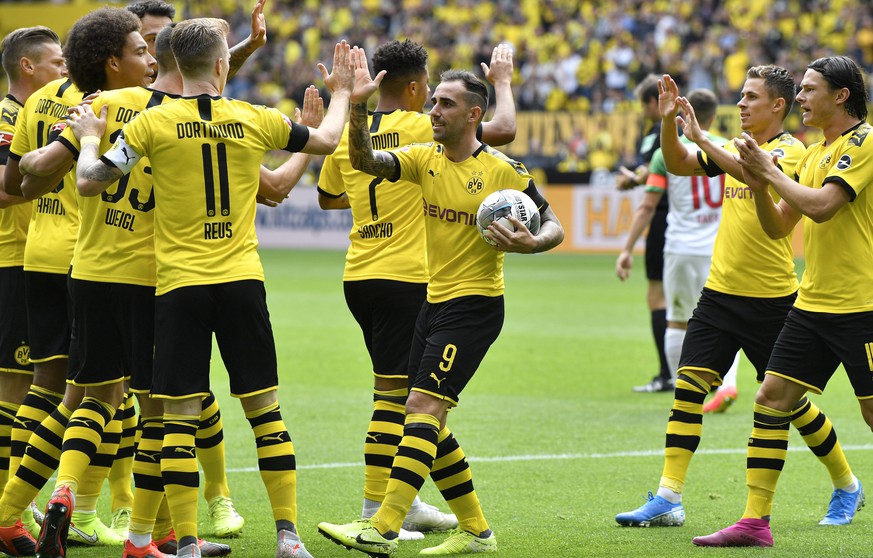 Dortmund&#039;s Paco Alcacer holds the ball as he celebrates after scoring his side&#039;s first goal during the German Bundesliga soccer match between Borussia Dortmund and FC Augsburg at the Signal  ...