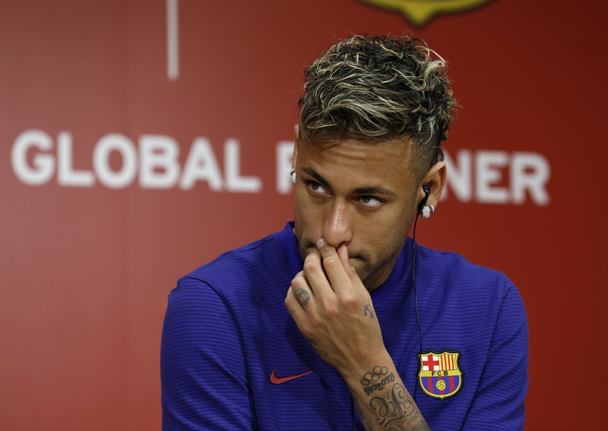 epa06084511 FC Barcelona&#039;s player Neymar reacts during a press conference in Tokyo, Japan, 13 July 2017. Spain&#039;s football club FC Barcelona and Japan&#039;s e-commerce and internet service c ...