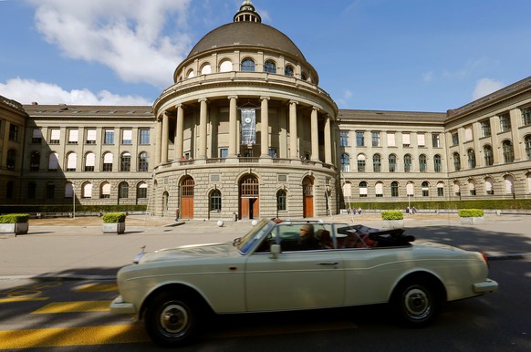 A Rolls-Royce convertible car drives past the Swiss Federal Institute of Technology Zurich (Eidgenoessische Technische Hochschule Zuerich - ETH) in Zurich, Switzerland May 20, 2016. REUTERS/Arnd Wiegm ...