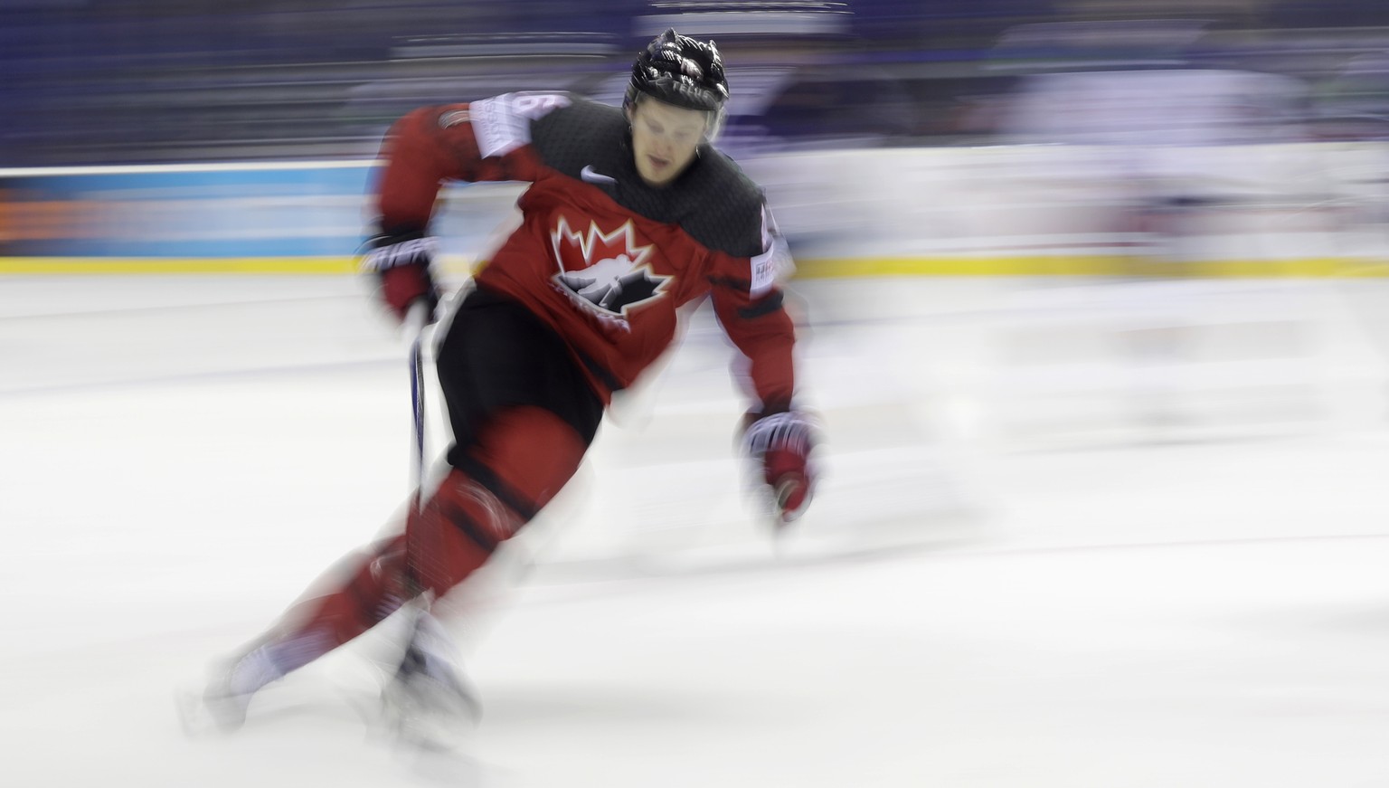 In this photo taken with slow shutter speed Canada&#039;s Jared McCann controls the puck during the Ice Hockey World Championships group A match between Great Britain and Canada at the Steel Arena in  ...