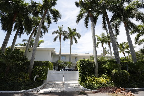 FILE - In this July 10, 2019 file photo, palm trees shade the Florida residence of Jeffrey Epstein in Palm Beach, Fla. The FBI said Thursday July 2, 2020, Ghislaine Maxwell, a British socialite who wa ...