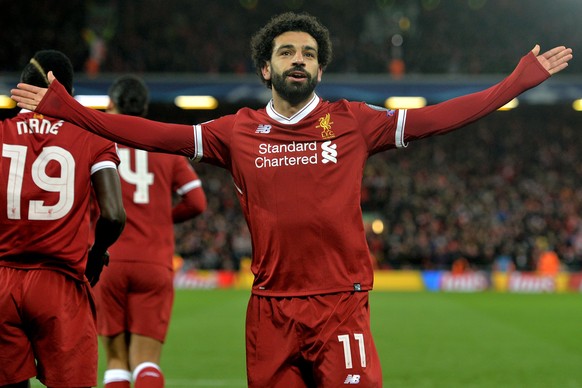 epa06645834 Liverpool&#039;s Mohamed Salah celebrates after scoring the 1-0 lead during the UEFA Champions League quarter final first leg match between FC Liverpool and Manchester City at Anfield Road ...