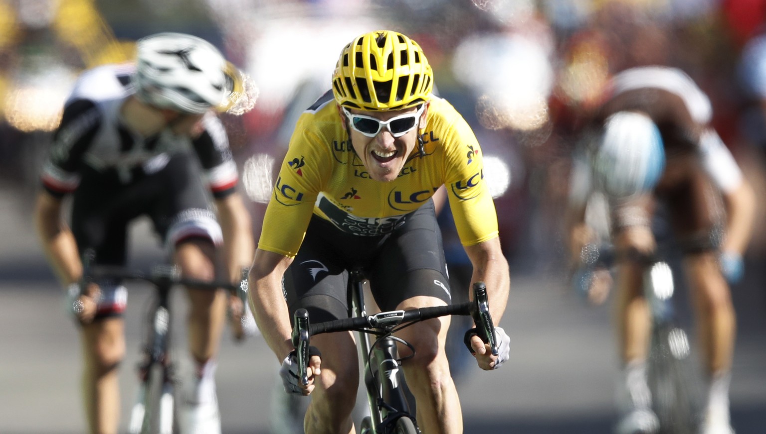 Britain&#039;s Geraint Thomas, wearing the overall leader&#039;s yellow jersey speeds to the finish line to win the twelfth stage of the Tour de France cycling race over 175.5 kilometers (109 miles) w ...