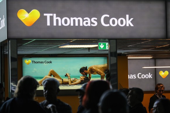 epa07863277 (FILE) - Passengers wait in front of a Thomas Cook Airlines counter at Terminal 1 of Frankfurt Airport in Frankfurt am Main, Germany, 05 September 2019 (issued 23 September 2019). More tha ...