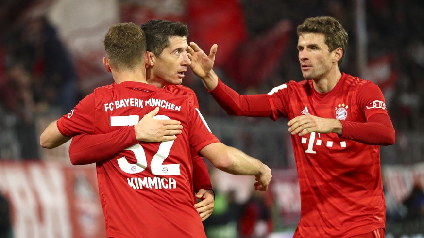 Bayern&#039;s Robert Lewandowski celebrates after scoring his side&#039;s fourth goal during the German soccer cup, DFB Pokal, match between FC Bayern Munich and TSG Hoffenheim in Munich, Germany, Wed ...