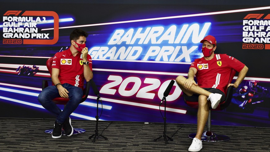 Ferrari drivers Sebastian Vettel of Germany and Charles Leclerc of Monaco participate in a media conference prior to the Bahrain Formula One Grand Prix at the International Circuit in Sakhir, Bahrain, ...