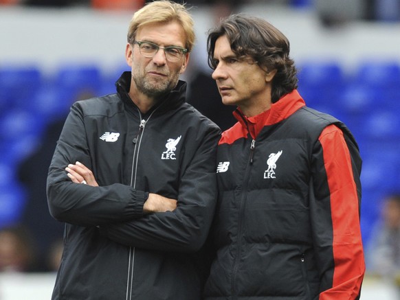 FILE - In this file photo dated Saturday, Oct. 17, 2015, Liverpool manager Juergen Klopp, left, talks with assistant manager Zeljko Buvac before their English Premier League soccer match against Totte ...