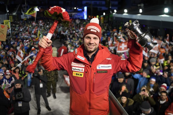 The winner Beat Feuz of Switzerland, celebrates during the prize giving ceremony after the men&#039;s downhill race at the Alpine Skiing FIS Ski World Cup in Wengen, Switzerland, Saturday, January 18, ...