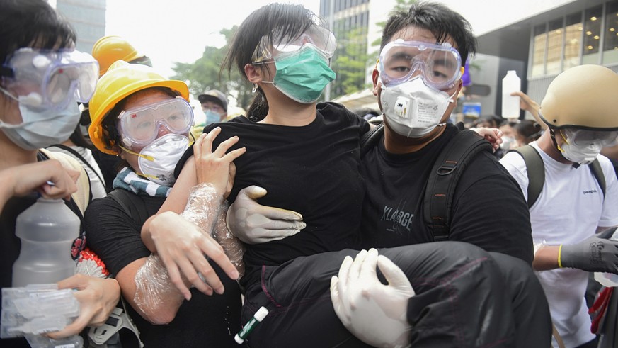 epa07643104 Protesters react during a rally against an extradition bill outside the Legislative Council in Hong Kong, China, 12 June 2019. The bill, scheduled for a second reading on 12 June has faced ...
