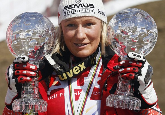 Renate Goetschl of Austria presents her crystal globes as the winner of the Overall Downhill and Super-G World Cup after the women&#039;s World Cup Super-G during the Alpine Ski World Cup finals, in P ...