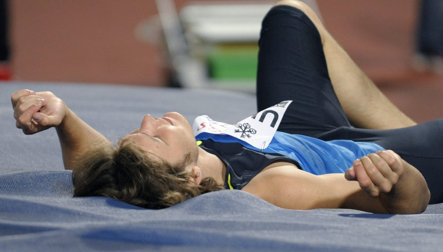 Russian Ivan Ukhov lies on his back after aborting a jump during the men&#039;s high jump competition at the Athletissima athletics meeting in the Stade Olympique in Lausanne, Switzerland, Tuesday, Se ...