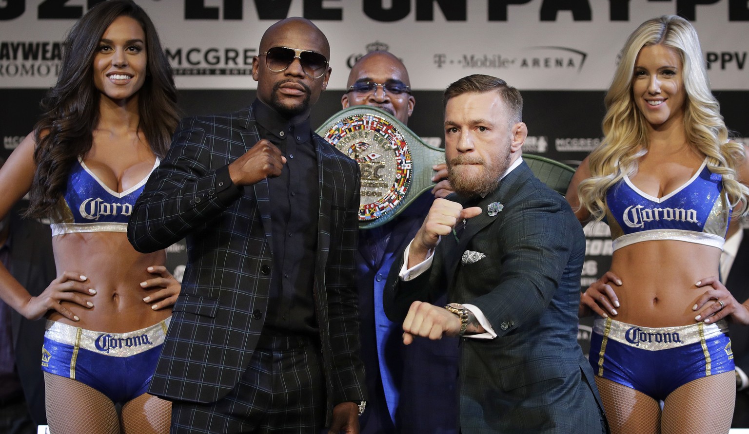 Floyd Mayweather Jr., left, and Conor McGregor pose for photographers during a news conference Wednesday, Aug. 23, 2017, in Las Vegas. The two are scheduled to fight in a boxing match Saturday in Las  ...