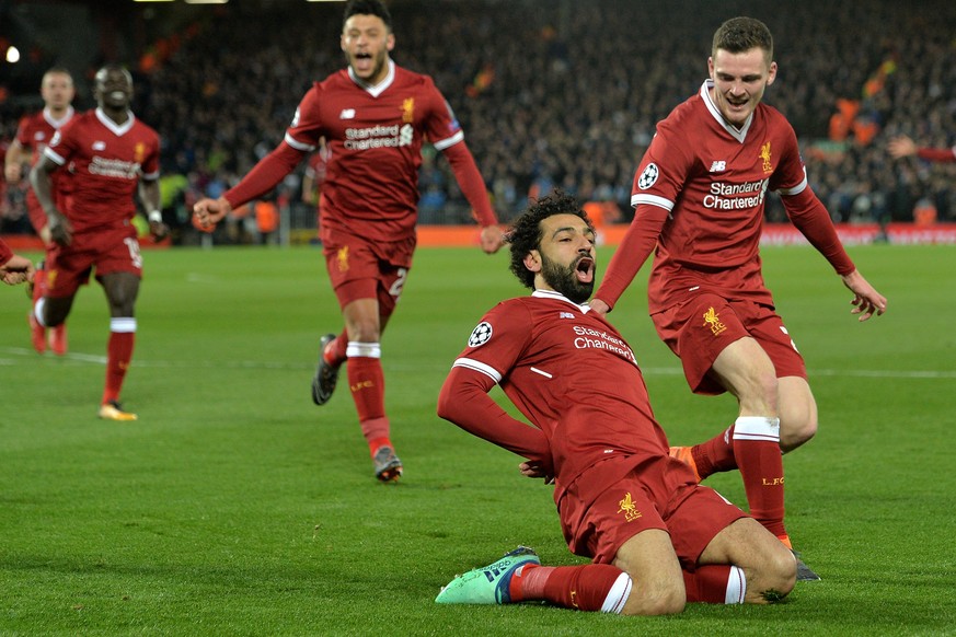 epa06645818 Liverpool&#039;s Mohamed Salah (2R) celebrates after scoring the 1-0 lead during the UEFA Champions League quarter final first leg match between FC Liverpool and Manchester City at Anfield ...