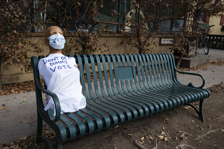 Half a mannequin urges people to vote with a hand-drawn t-shirt on a bus stop bench on Election Day in Aspen, Colo., on Tuesday, Nov. 3, 2020. (Kelsey Brunner/The Aspen Times via AP)