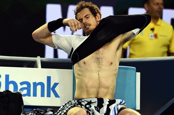 epa05133302 Andy Murray of the United Kingdom puts on a shirt during play against Milos Raonic of Canada during their Men&#039;s semi final match on day twelve of the Australian Open tennis tournament ...