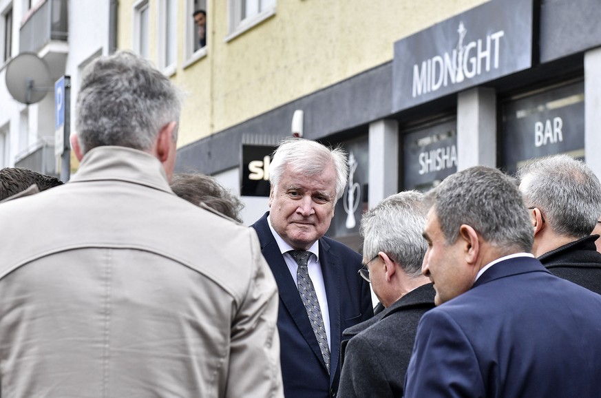 German Interior Minister Horst Seehofer stands in front of the hookah bar where several people were killed late Wednesday in Hanau, Germany, Thursday, Feb. 20, 2020. A 43-year-old German man shot and  ...