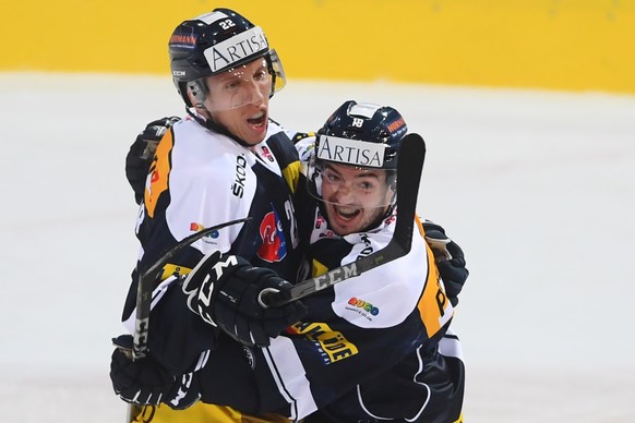 Ambri&#039;s player Diego Kostner , left, celebratsthe 1-0 goal, with Ambri&#039;s player Noele Trisconi scorer , right, during the regular season game of the National League Swiss Championship 2018/1 ...