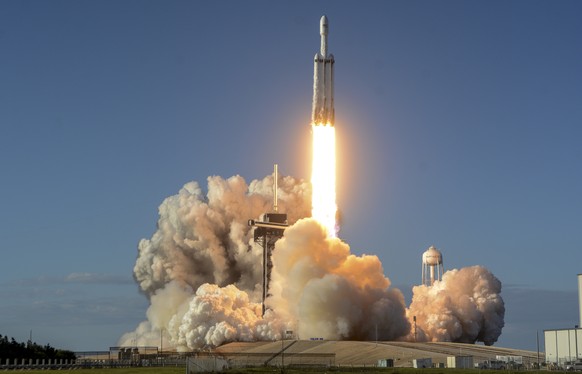 A SpaceX Falcon Heavy rocket carrying a communication satellite lifts off from pad 39A at the Kennedy Space Center in Cape Canaveral, Fla., Thursday, April 11, 2019. (Craig Bailey/Florida Today via AP ...