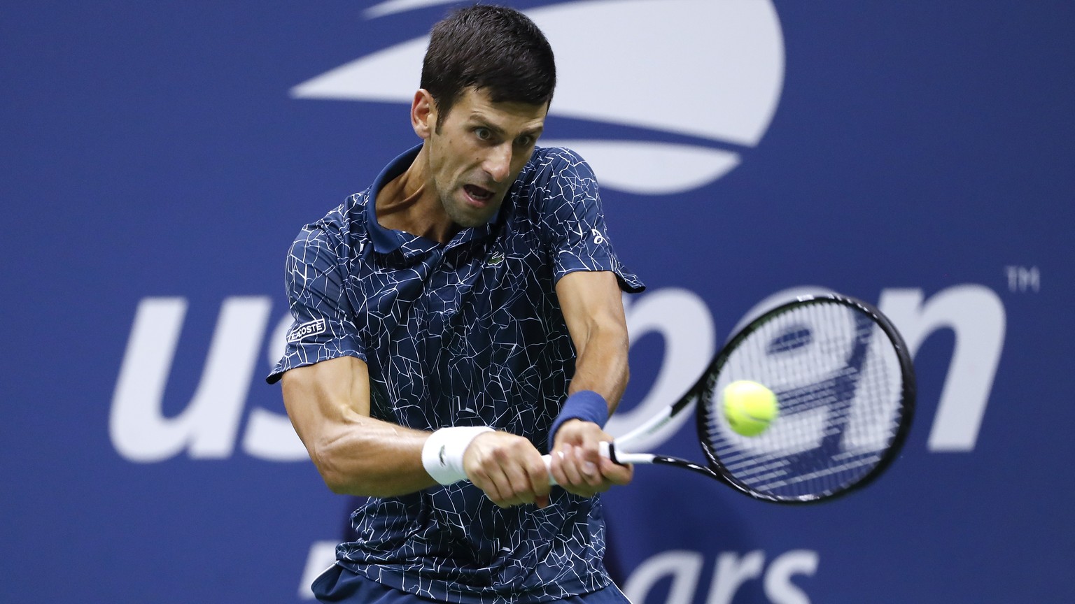 FILE - In this Sept. 9, 2018, file photo, Novak Djokovic, of Serbia, returns a shot to Juan Martin del Potro, of Argentina, during the men&#039;s final of the U.S. Open tennis tournament in New York.  ...