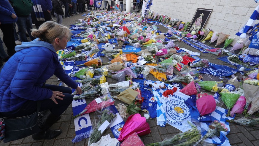 Flowers are placed outside Leicester City Football Club after a helicopter crashed in flames the previous day, in Leicester, England, Sunday, Oct. 28, 2018. A helicopter belonging to Leicester City&#0 ...