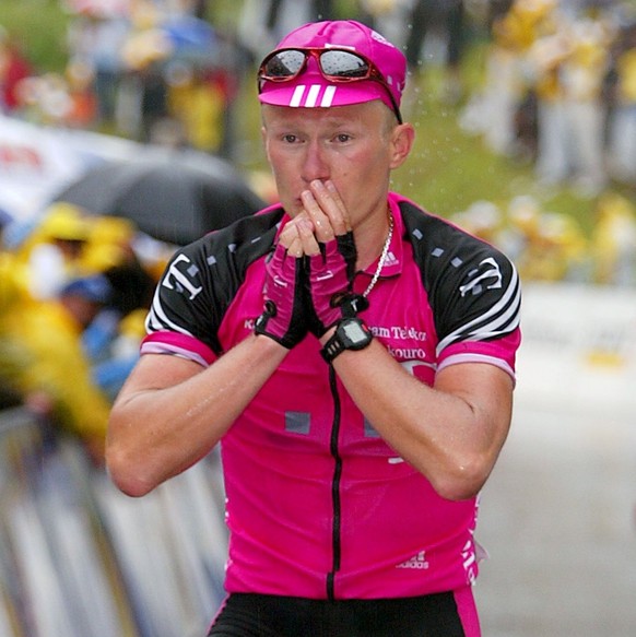 Alexander Vinokourov of Kazakhstan reacts after he crosses the finish line to win the 3rd stage Domat/Ems to Samnaun at the Tour de Suisse cycling race in Samnaun, Switzerland, Friday, June 21, 2002.  ...
