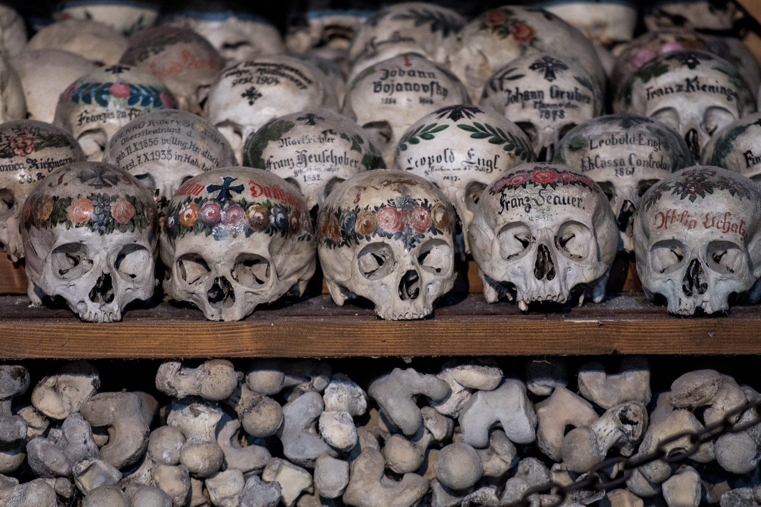 epa05574823 Human skulls and bones at the Bone House (Beinhaus) in the Austrian UNESCO world heritage village of Hallstatt, some 300 kilometers southwest of Vienna, Austria, 07 October 2016. The Bone  ...