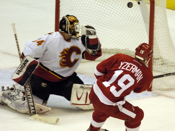 The Detroit Red Wings&#039; Steve Yzerman scores a second-period goal on the Calgary Flames&#039; Miikka Kiprusoff, of Finland, Saturday, April 24, 2004, during game 2 of their NHL playoff second-roun ...